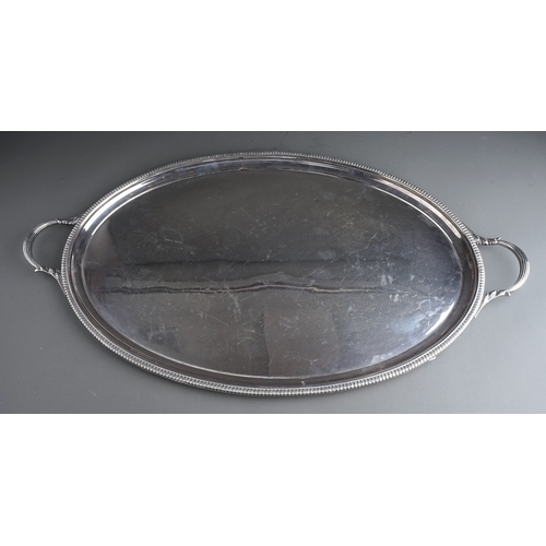 396 - A George VI silver oval two handled tray with gadroon border, plain reserve, approx 85 ozt (2.65kg) ... 