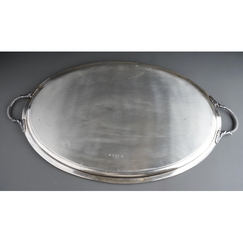 396 - A George VI silver oval two handled tray with gadroon border, plain reserve, approx 85 ozt (2.65kg) ... 