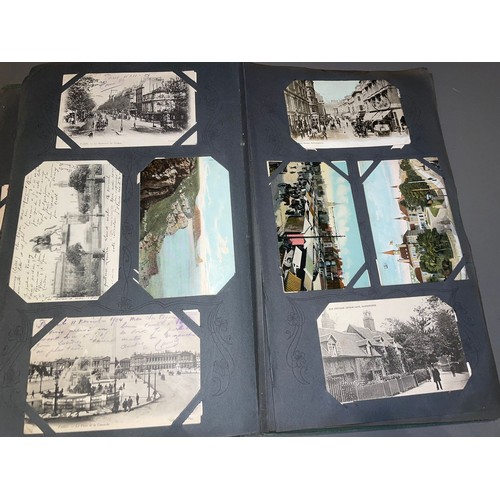 398 - Three early 20th Century postcard albums; Edwardian, War Time and later, one containing coloured or ... 