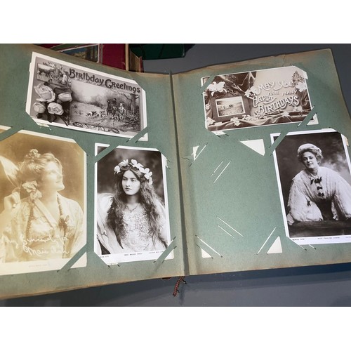 398 - Three early 20th Century postcard albums; Edwardian, War Time and later, one containing coloured or ... 