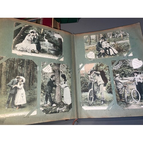 398 - Three early 20th Century postcard albums; Edwardian, War Time and later, one containing coloured or ... 