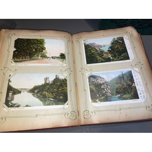 398 - Three early 20th Century postcard albums; Edwardian, War Time and later, one containing coloured or ... 