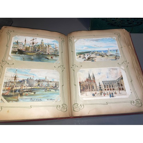 398 - Three early 20th Century postcard albums; Edwardian, War Time and later, one containing coloured or ... 