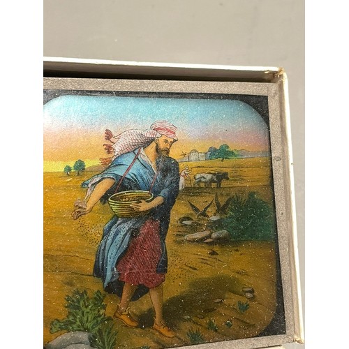 404 - Assorted collection of early 20th Century coloured lantern slides including boxed Wild Animals, Wop ... 