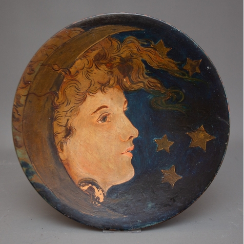 407 - An early 20th Century Continental painted earthenware charger painted with a Lady wearing crescent s... 