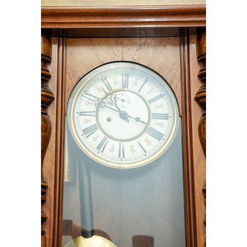 410 - A mahogany cased Viennese regulator, cream dial with Roman Numerals and subsidiary dial, turned pila... 