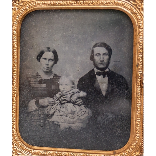 443 - A Victorian Daguerreotype depicting a Mother and Father with their baby within gilt metal frame, in ... 