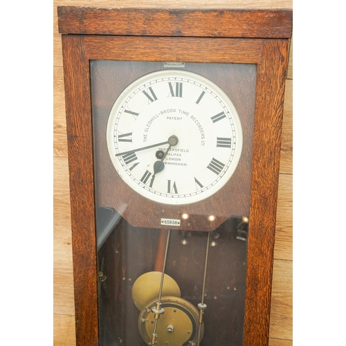 452 - The Gledhill Brook Time Recorders Ltd: an early 20th century oak cased clocking-in clock, number 658... 