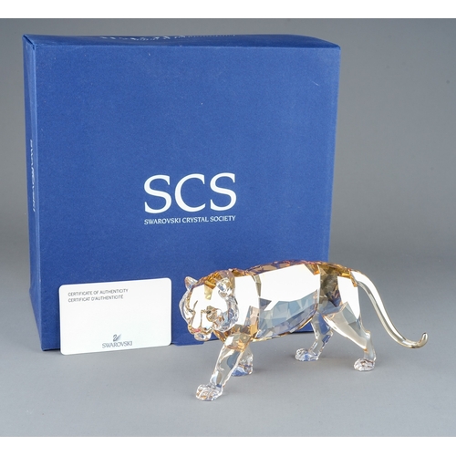 580 - A Swarovski Crystal Club tinted crystal figure of a Tiger from the Endangered Wildlife series, boxed... 