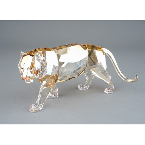 580 - A Swarovski Crystal Club tinted crystal figure of a Tiger from the Endangered Wildlife series, boxed... 