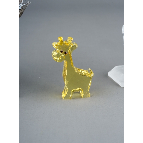 582 - Three Swarovski Crystal Society models to include: prancing Horse; Chinese Year of the Dragon 2012 a... 