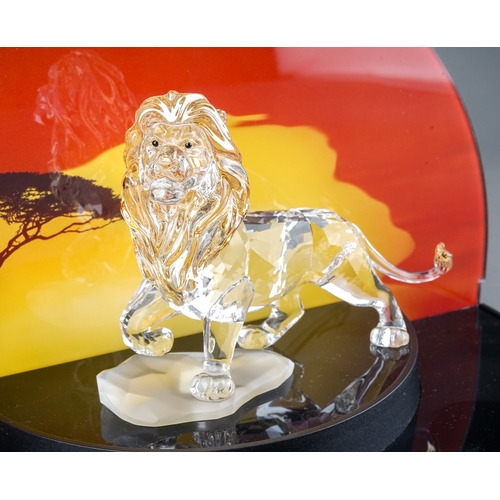 583 - A Swarovski Disney Lion King tinted crystal figure of Mufasa, boxed with outer sleeve together with ... 