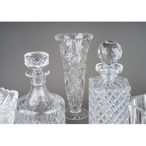 584 - Assorted cut and moulded glass to include painted cup and saucer, decanters and stoppers, bowls, vas... 