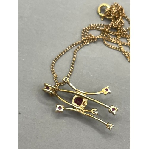 586 - A 9k yellow gold ruby and diamond pendant necklace, gross weight approx 1.4g