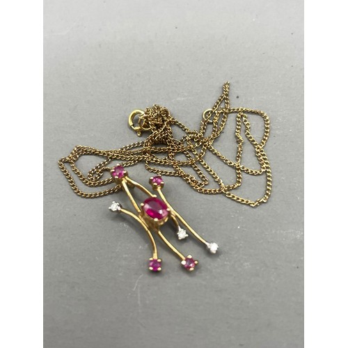 586 - A 9k yellow gold ruby and diamond pendant necklace, gross weight approx 1.4g