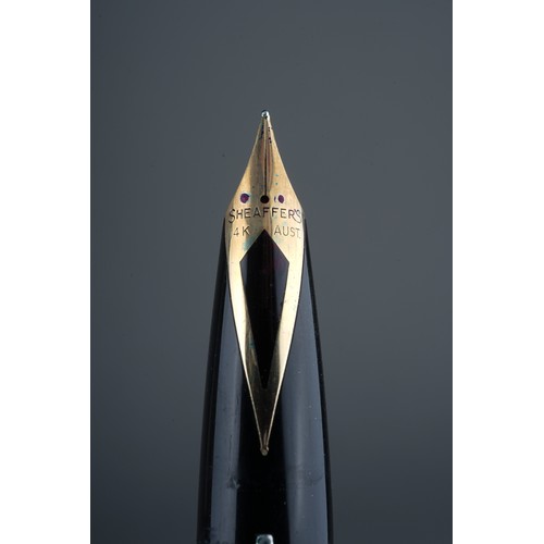 591 - A Sheaffer fountain pen, 14k gold nib, boxed; a Sheaffer roller ball pen, boxed; a parker ball point... 