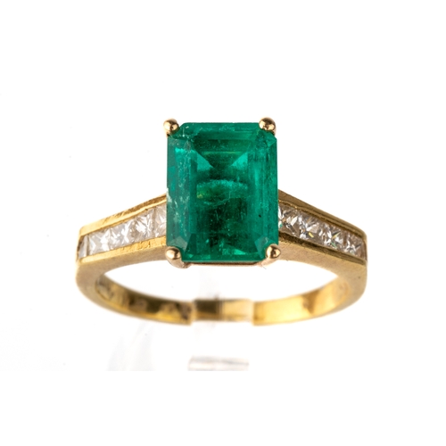 83A - An 18k yellow gold emerald and diamond ring, the step-cut emerald approx 9.5mm x 7mm, in four prong ... 