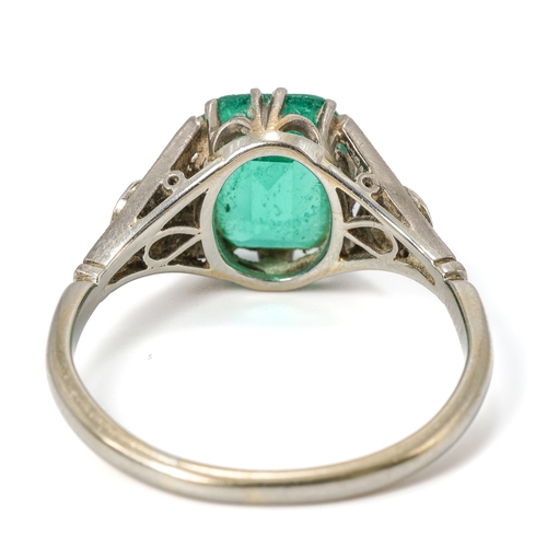 25A - An Art Deco platinum green stone and diamond ring, the green stone approx 9mm x 7mm x 4.4mm, two old... 