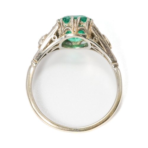 25A - An Art Deco platinum green stone and diamond ring, the green stone approx 9mm x 7mm x 4.4mm, two old... 