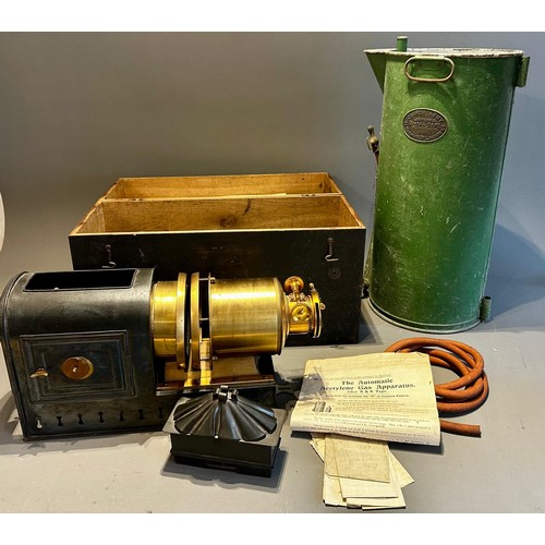 414 - A late 19th Century tin plate and brass magic lantern with Stocks patent lamp, in tinplate carrying ... 