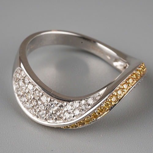 3 - An 18ct white gold yellow and white diamond dress ring, set with a wave of yellow round-brilliant cu... 