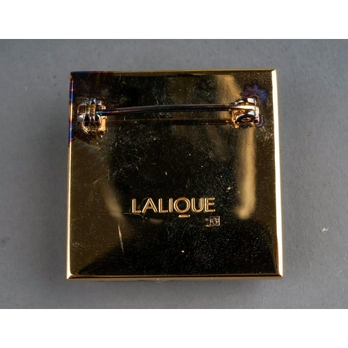 20 - Lalique - a Masque de Femme brooch, approx 3cm x 3cm; and a pair of ear clips, boxed with paperwork ... 