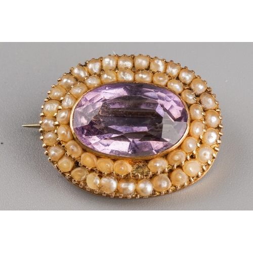 33 - A Victorian 9ct yellow gold amethyst and seed pearl oval brooch, approx 2.5cm wide, gross weight app... 