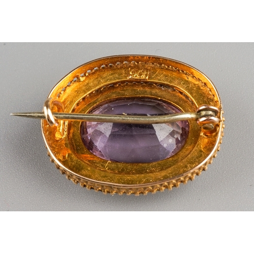 33 - A Victorian 9ct yellow gold amethyst and seed pearl oval brooch, approx 2.5cm wide, gross weight app... 