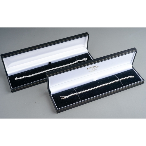 41 - A 9ct white gold and diamond line bracelet, the clasp stamped '0.25', approx 18cm long, gross weight... 