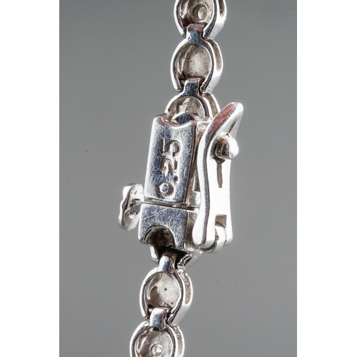 41 - A 9ct white gold and diamond line bracelet, the clasp stamped '0.25', approx 18cm long, gross weight... 