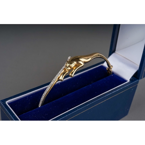 49 - A 9ct yellow gold and CZ hinged panther bangle, with a leaping panther and a line of cubic zirconia,... 