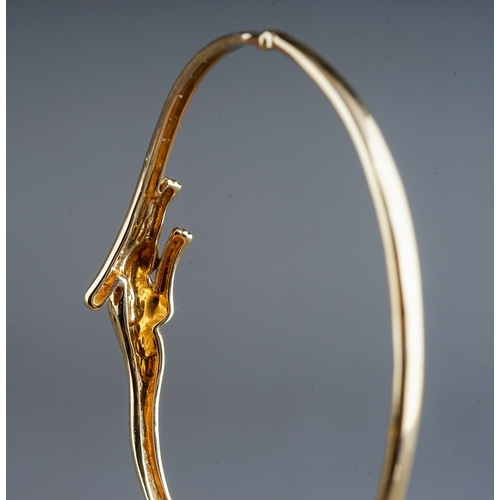 49 - A 9ct yellow gold and CZ hinged panther bangle, with a leaping panther and a line of cubic zirconia,... 