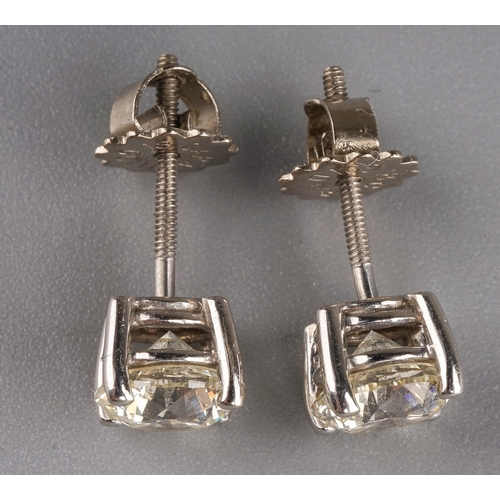 50 - A pair of 18k white gold and diamond solitaire earrings, each diamond in four-claw settings, estimat... 