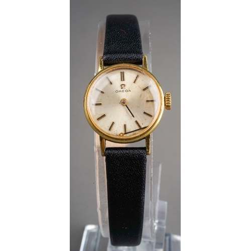 56 - A ladies gold plated Omega wristwatch, 18mm circular dial, baton indicators, black leather strap, bo... 