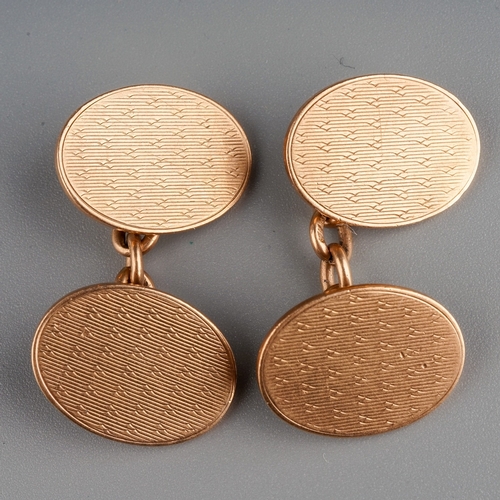 62 - A pair of 9ct rose gold oval cufflinks, engine turned detail, approx 17mm x 8mm, gross weight approx... 