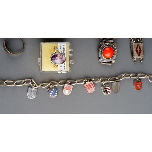 67 - A collection of white metal jewellery, including enamelled souvenir bracelets, filigree brooch, blue... 