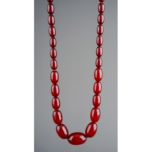 69 - A cherry amber bead necklace, approx 30.9g