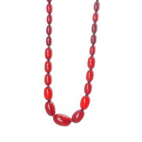 69 - A cherry amber bead necklace, approx 30.9g