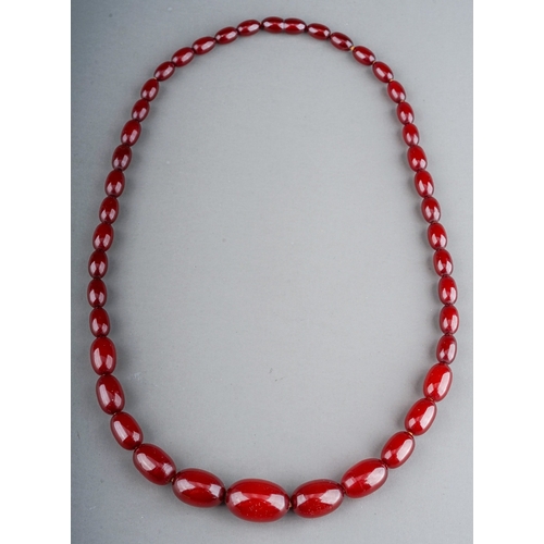 69 - A cherry amber bead necklace, approx 30.9g