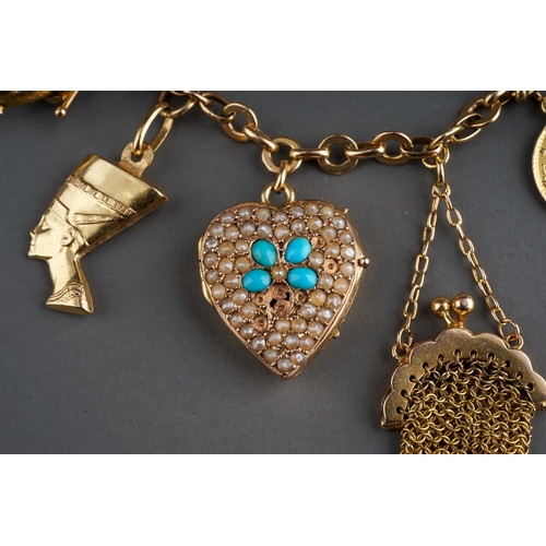 71 - A charm bracelet, suspending gold mesh purse stamped '18ct', Egyptian gold charms of camel and phara... 