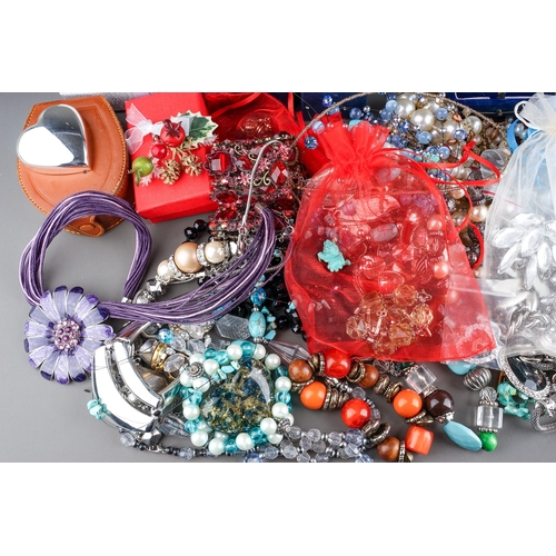 77 - A large collection of costume jewellery, including silver rings, chains, beads, watches, pearls, etc