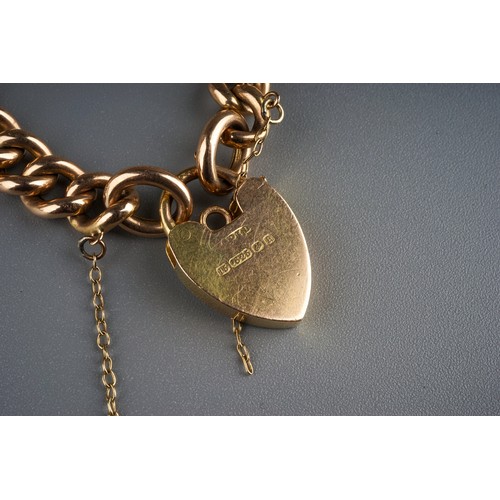 80 - Gold 15ct  heart shaped lock on a 9ct gold bracelet.  12.5g total weight