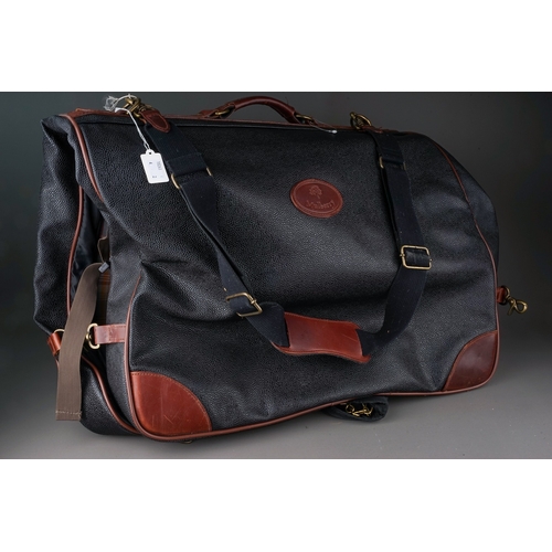 93 - Two pieces of Mulberry style black leather effect and dark bown leather trimmed luggage, comprising ... 