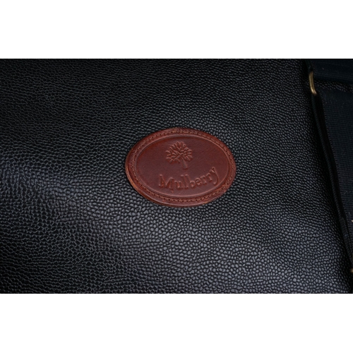 93 - Two pieces of Mulberry style black leather effect and dark bown leather trimmed luggage, comprising ... 