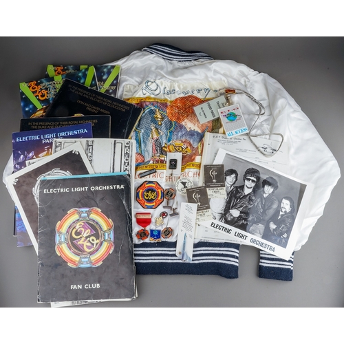 106 - E.L.O Memorabilia Fan Club and Tour items including :
Satin white jacket customised with a Discovery... 