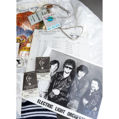 106 - E.L.O Memorabilia Fan Club and Tour items including :
Satin white jacket customised with a Discovery... 