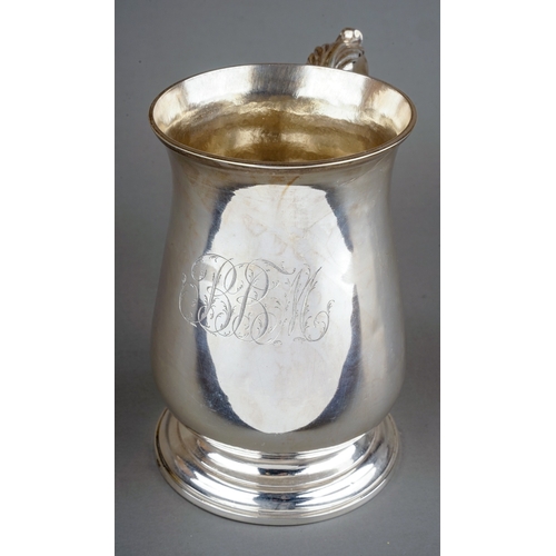 178 - A George III silver baluster tankard / mug on circular stepped foot, the body engraved with initials... 