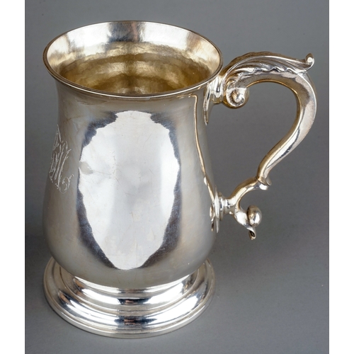 178 - A George III silver baluster tankard / mug on circular stepped foot, the body engraved with initials... 