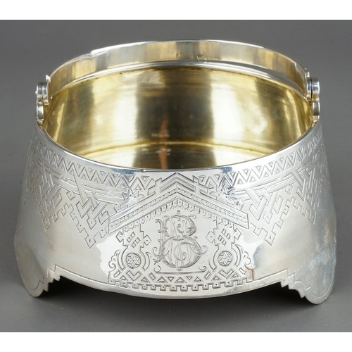 181 - A 19th Century Russian silver circular sugar bowl / basket with swing handle, the body engraved with... 