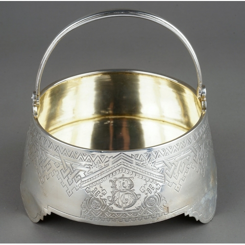 181 - A 19th Century Russian silver circular sugar bowl / basket with swing handle, the body engraved with... 